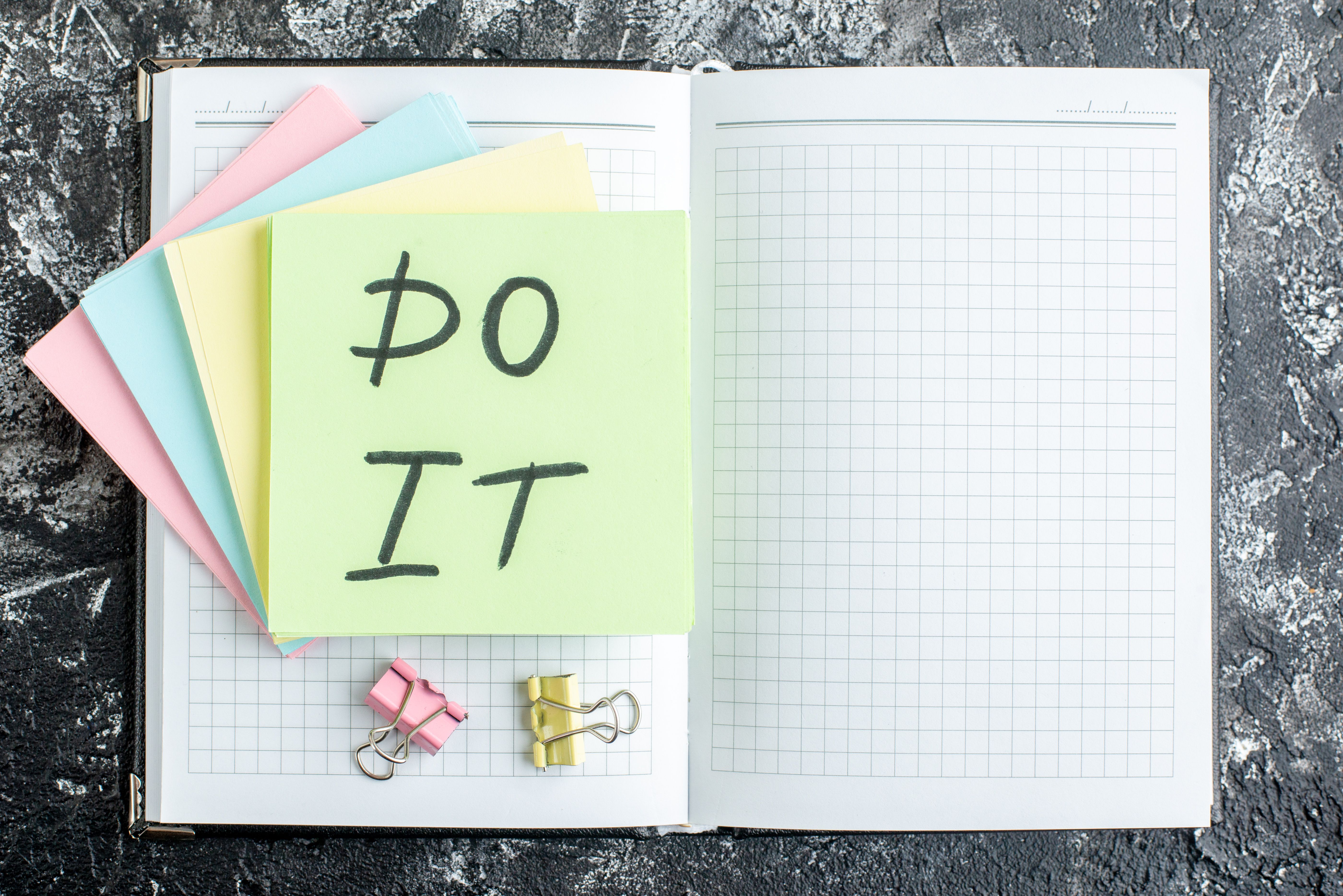 top-view-it-note-with-stickers-notepad-dark-gray-background.jpg